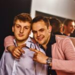 Two young men posing for a picture