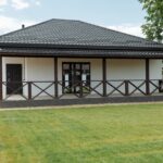 Modern house for sale with a spacious lawn and inviting facade, perfect for families.