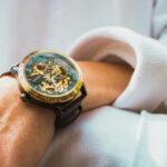 A detailed view of a mechanical wristwatch showcasing intricate gears and design.