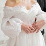 Elegant wedding embrace featuring bride and groom in İstanbul, showcasing love and modern bridal fashion.