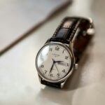 Close-up of a classic Longines luxury wristwatch with leather strap and elegant design.