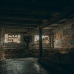 Explore the eerie beauty of an urban abandoned building with graffiti art and broken windows.